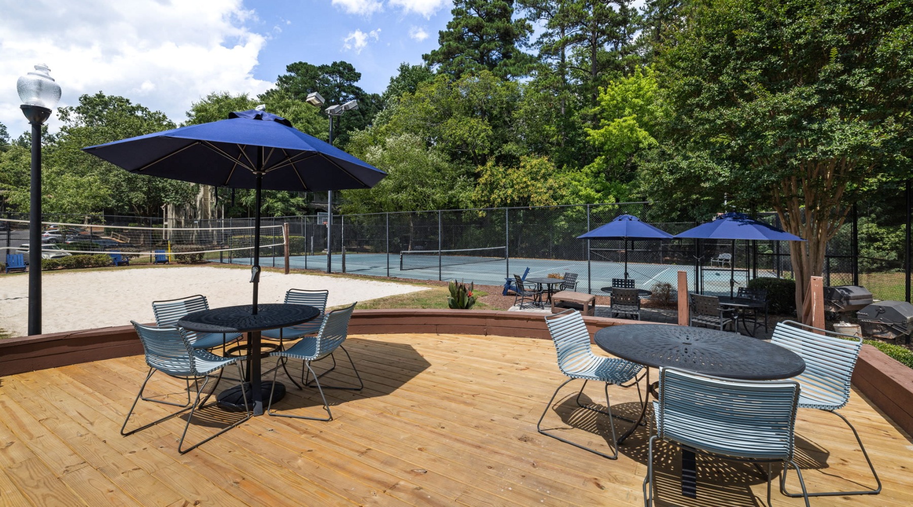 Access to resident only features a deck with seating and umbrellas