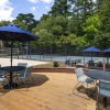 a deck with seating and umbrellas