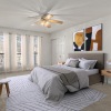 bedroom with bed and large windows