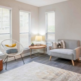 Love where you live a living room with seating and a table