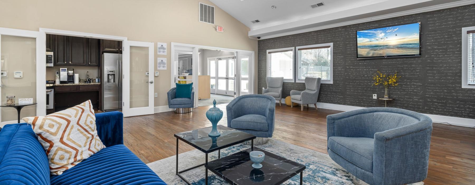 a living room with a couch and chairs