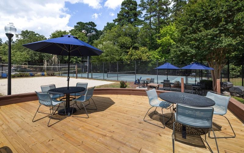 a group of tables and chairs on a deck