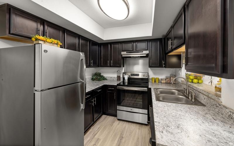 a kitchen with black cabinets