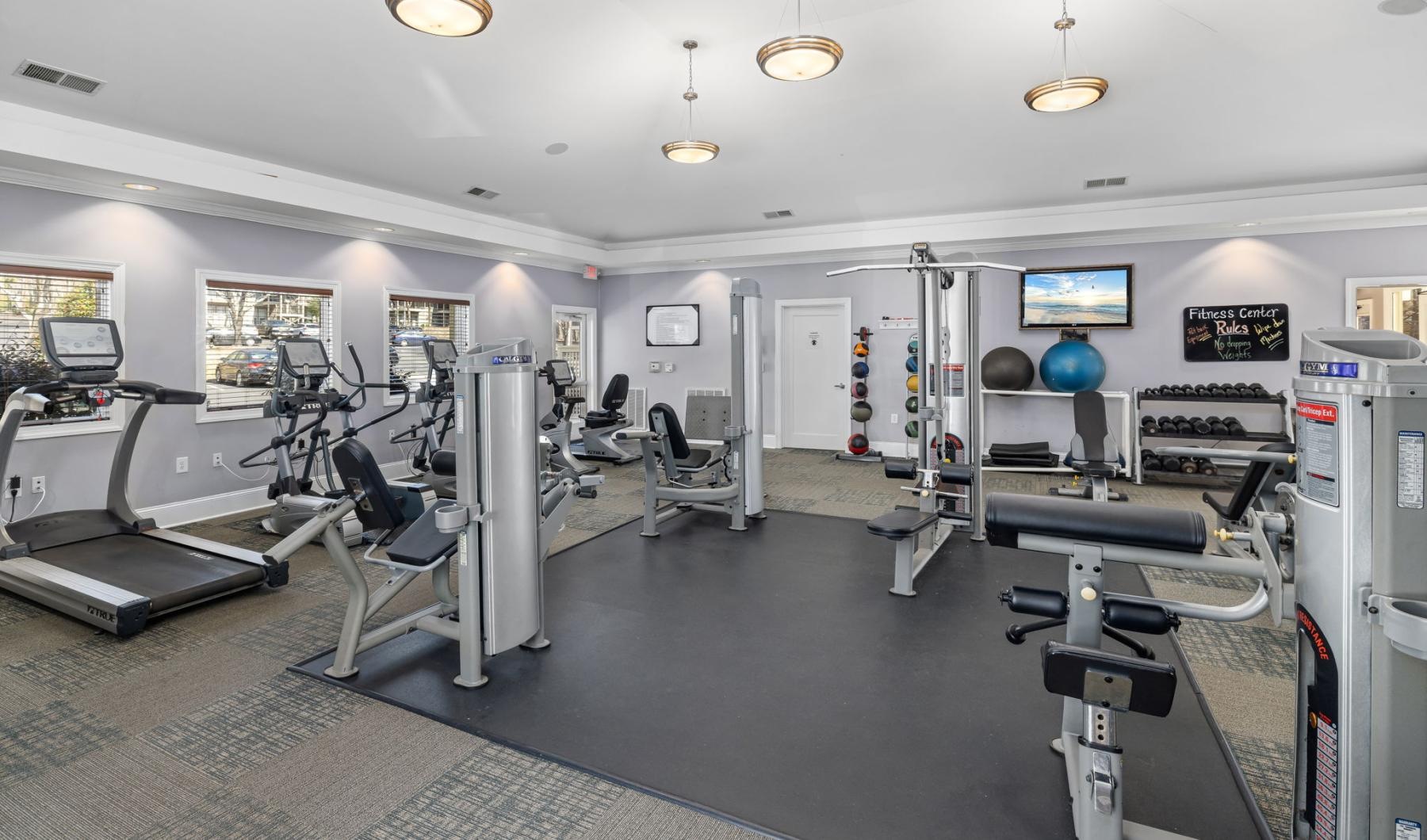 Quick access to state-of-the-art amenities a room with exercise equipment