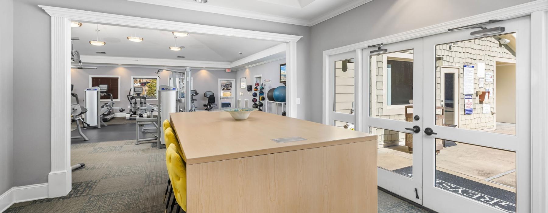 a room with a counter and chairs